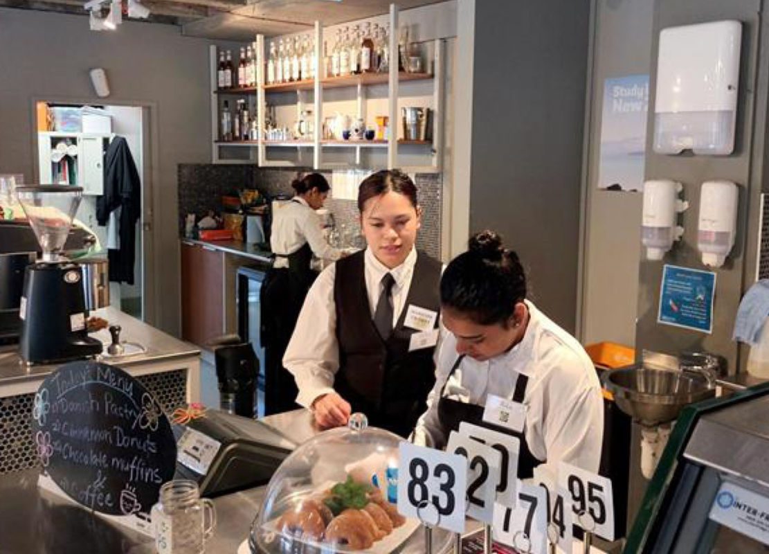 Aisha running café as manager